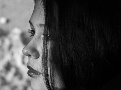 Close up of a person's hands during a pose.